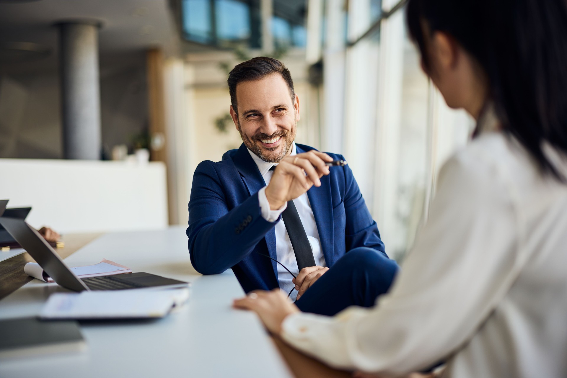Professional Businessman Discussing Ideas During a Meeting in a Modern Office Space